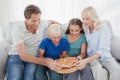 Family eating pizza together Royalty Free Stock Photo