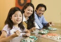 Family Eating Sushi Together portrait Royalty Free Stock Photo