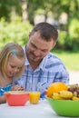 Family eating together at summer park Royalty Free Stock Photo