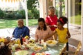 Family eating together at table Royalty Free Stock Photo