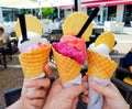 The family eats ice cream. Sweet ice cream travel. Ice cream in hand close-up.