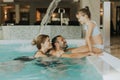 Family in the indoor swimming pool Royalty Free Stock Photo