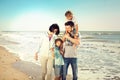 Family enjoyed walking on the beach at the sea Royalty Free Stock Photo