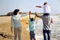 Family enjoyed walking on the beach at the sea Royalty Free Stock Photo