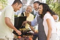 Family Enjoying A Barbeque Royalty Free Stock Photo