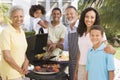 Family Enjoying A Barbeque