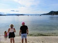 A family enjoying the beautiful beaches and admiring the pretty ocean view of Galiano Island in Montague Harbour, British Columbia