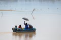 Family enjoying boating during hot summer vacation