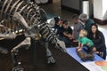 Family enjoying dinosaur exhibit museum