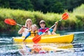 Family enjoying kayak ride on a river