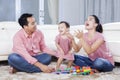 Family enjoying leisure time in the living room Royalty Free Stock Photo