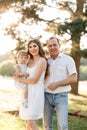 Family enjoying life together in the summer park. People having fun in nature. Happy young family outdoors. Mother, father, child Royalty Free Stock Photo