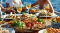 A family enjoying a picnicstyle meal on the deck of a yacht with a variety of dishes displayed on a large woven platter