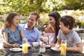 Family Enjoying Snack At Outdoor CafÃ¯Â¿Â½ Together Royalty Free Stock Photo