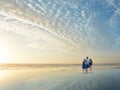 Family enjoying time together on beautiful beach.