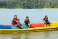 Family enjoying water activities on banana boat at the Kenyir Lake, Terengganu, Malaysia Royalty Free Stock Photo