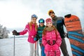 Family enjoying winter vacations in mountains. Ski, Sun, Snow an Royalty Free Stock Photo