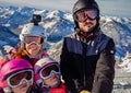 Family enjoying winter vacations taking selfie in skiing gear Royalty Free Stock Photo