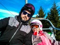 Family enjoying winter vacations taking selfie in skiing gear Royalty Free Stock Photo