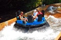 A family enjoys a water ride at an amusement park