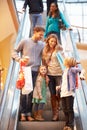 Family On Escalator In Shopping Mall Together Royalty Free Stock Photo