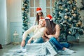 Young beautiful family in a Christmas setting. Mother, father and daughter Royalty Free Stock Photo