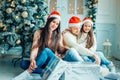 Family exchanging gifts in front of Christmas tree Royalty Free Stock Photo