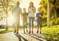 Family exercising and jogging together at the park Royalty Free Stock Photo