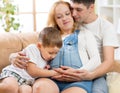 Family expecting new baby. Little boy touching Royalty Free Stock Photo