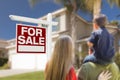 Family Facing For Sale Real Estate Sign and House Royalty Free Stock Photo