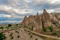 Family of fairy chimneys under cloudy sky