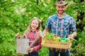 Family farm. spring village country. ecology. Watering can and shovel. little girl and happy man dad. earth day. father