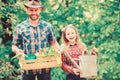 Family farm. spring village country. ecology. Watering can and shovel. little girl and happy man dad. earth day. father Royalty Free Stock Photo