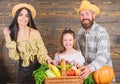 Family farmers with harvest wooden background. Family rustic style farmers market with fall harvest. Parents and Royalty Free Stock Photo