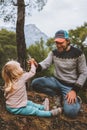 Family father and baby daughter having fun outdoor walking in forest travel vacations