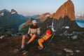 Family father and child sitting in camping chairs outdoor traveling in Norway mountains dad with daughter hiking together