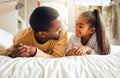 Family, father and girl child talking, spending quality time together with love and care, relax in bedroom at home Royalty Free Stock Photo