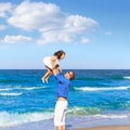 Family father holding daughter playing beach Royalty Free Stock Photo