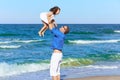 Family father holding daughter playing beach Royalty Free Stock Photo