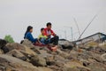 Family father, mother and son are filling the holiday by fishing on the river