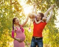 Family. Father, pregnant mother and daughter outdoors Royalty Free Stock Photo