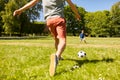 Father with little son playing soccer at park Royalty Free Stock Photo