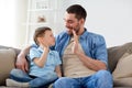 Father and son doing high five at home Royalty Free Stock Photo