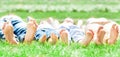 Family feet on grass