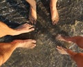 Family feet - mother, father and child at seaside Royalty Free Stock Photo