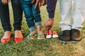 Family feet posing for baby announcement