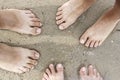 Family feet on sand Royalty Free Stock Photo