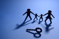 Family figure with jigsaw puzzle key Royalty Free Stock Photo