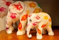 Family of the figures of elephants by unknown artist inside art store with toys