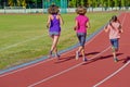 Family fitness, active mother and kids running on stadium track Royalty Free Stock Photo